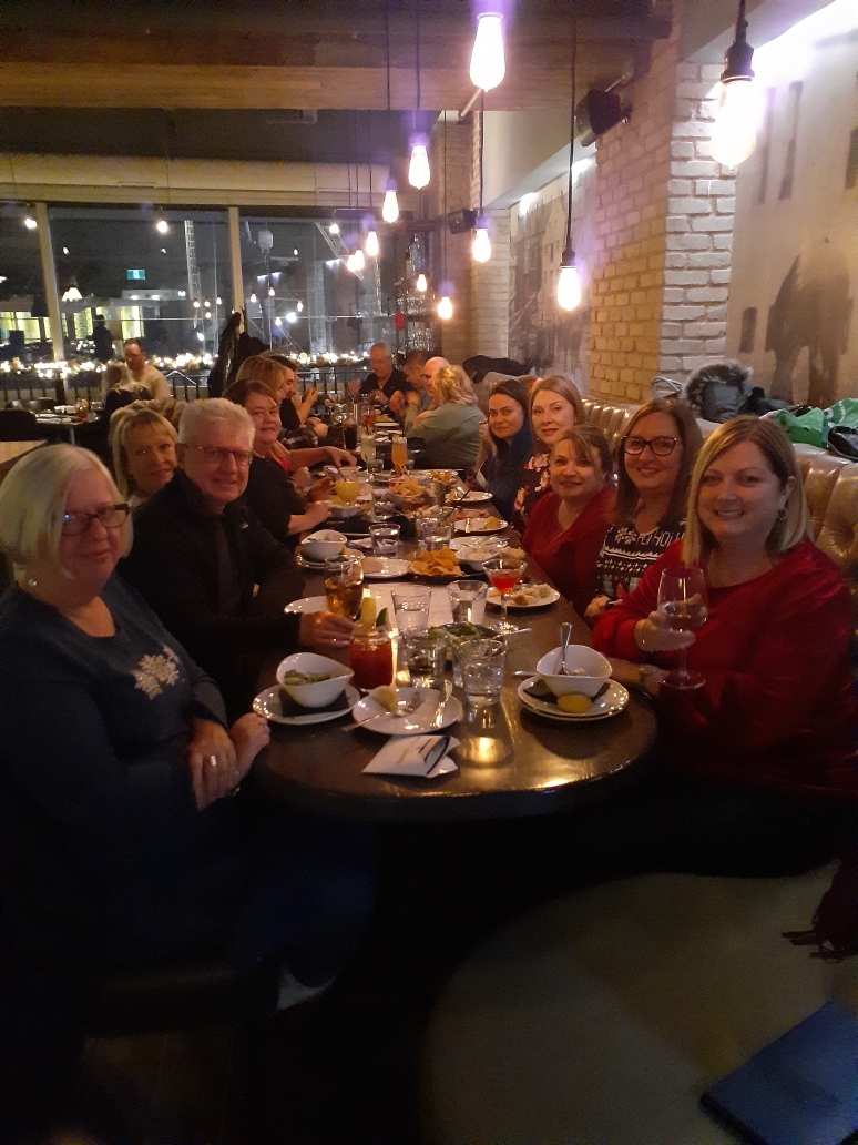 Tis the season to celebrate! PSCU employees celebrating at a local restaurant, the Fish Exchange with fine food and refreshments.